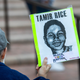 A supporter holds a sign on Tuesday, November 9, 2021, in Cleveland, during a rally for Tamir Rice, who was killed by police in 2014.